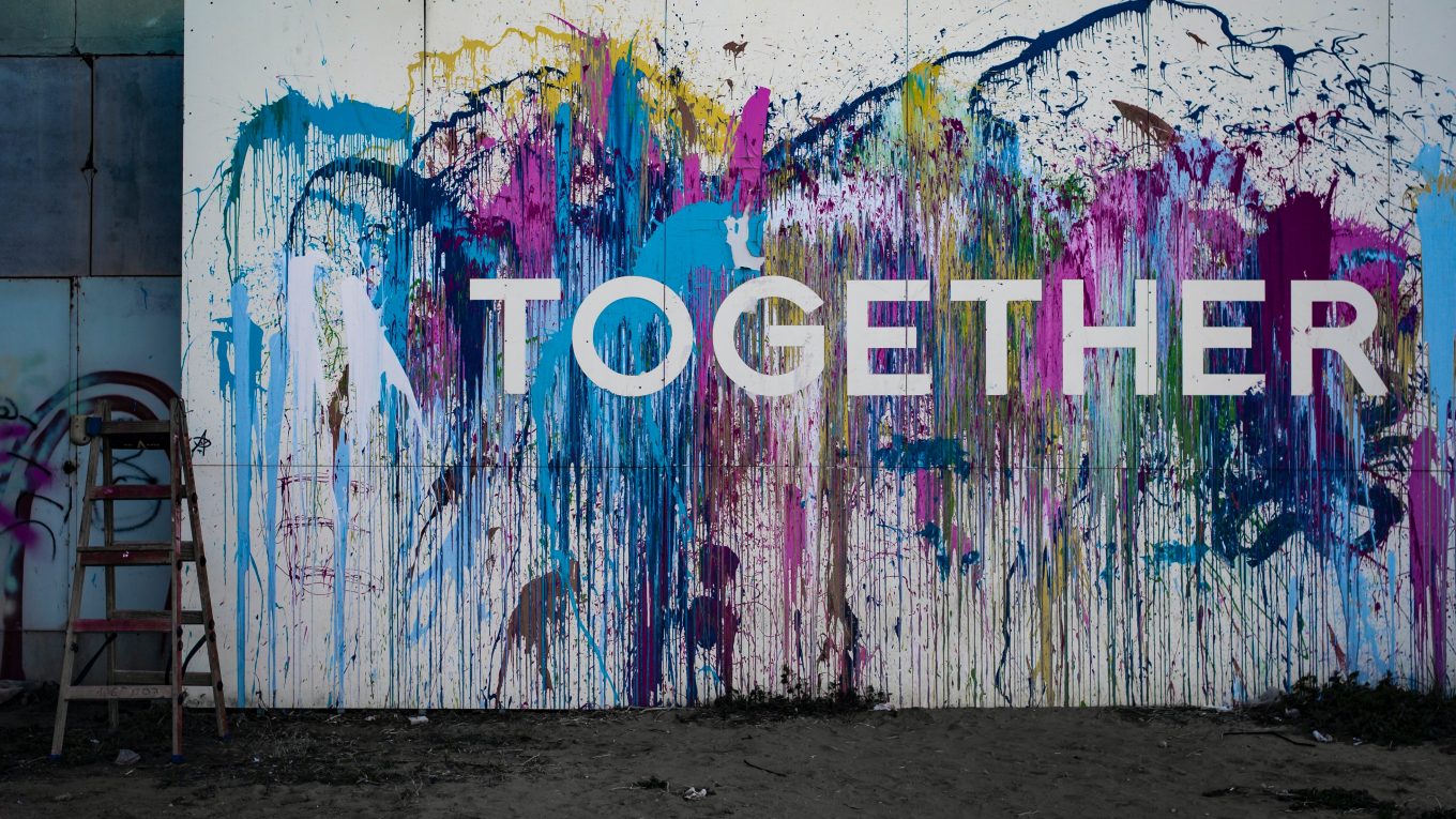 paint splattered behind title word - together