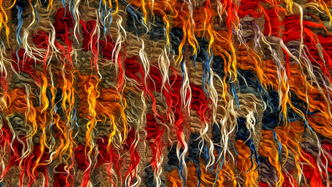 multicoloured threads woven into fabric