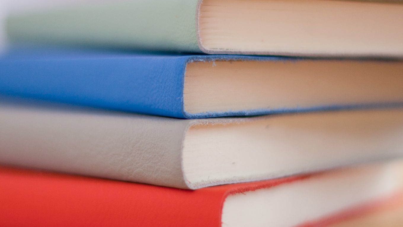 stack of notebooks in different colours