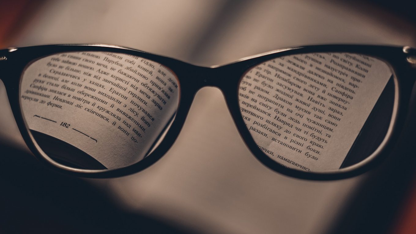 glasses resting on a book